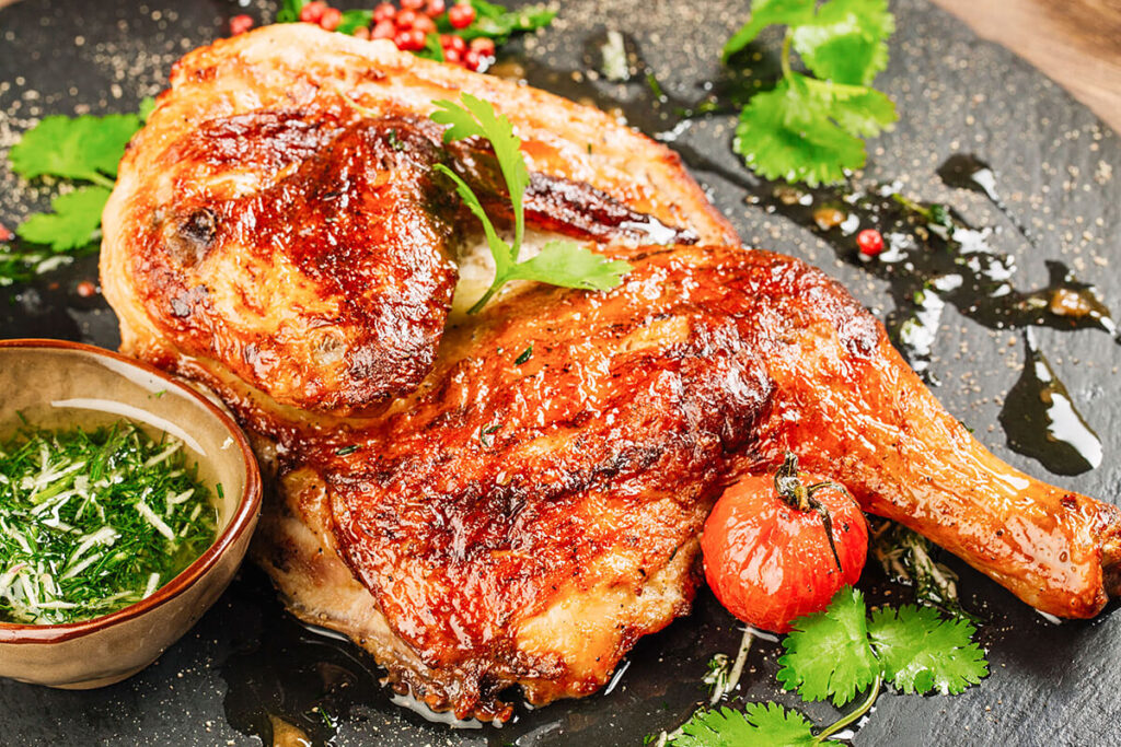 Delicious homemade chicken dish from 12 Tomatoes, served with fresh herbs and vegetables